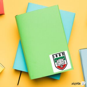 استیکر لپ تاپ تیم ملی فوتبال ایران روی دفترچه