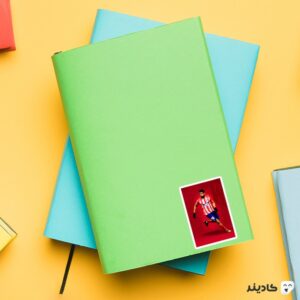 استیکر لپ تاپ دیگو کاستا روی دفترچه