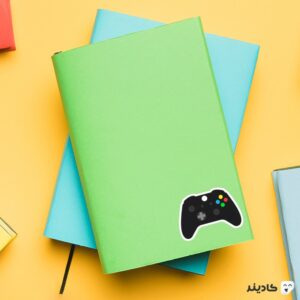 استیکر لپ تاپ جی تی ای - دسته ی بازی روی دفترچه