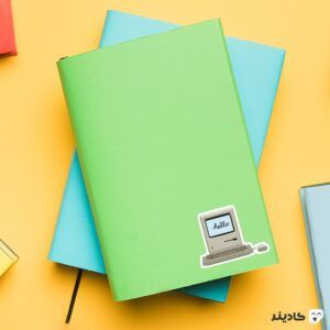 استیکر لپ تاپ استیو جابز - مکینتاش روی دفترچه