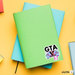 استیکر لپ تاپ جی تی ای - پوستر GTA V روی دفترچه