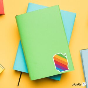 استیکر لپ تاپ تیم کوک - لوگوی رنگین کمانی اپل روی دفترچه