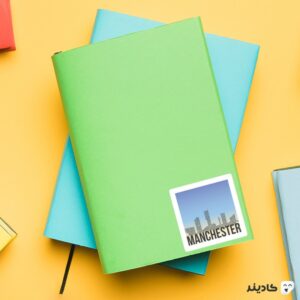 استیکر لپ تاپ سریال جوخه برادران - پوستر منچستر روی دفترچه