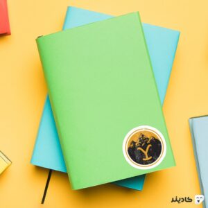 استیکر لپ تاپ سریال یلو استون - کوه های زرد روی دفترچه