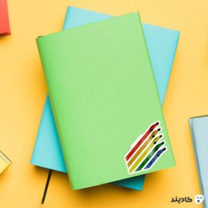 استیکر لپ تاپ شرکت تسلا - تسلا رنگین کمانی روی دفترچه