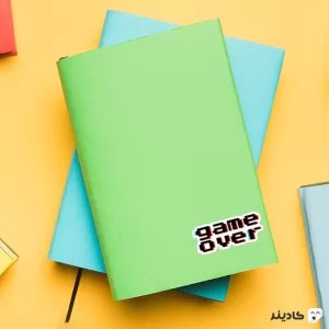 استیکر لپ تاپ ماینکرفت - Game Over روی دفترچه